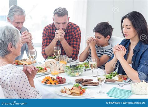 Family Praying Together before Meal Stock Photo - Image of abode ...