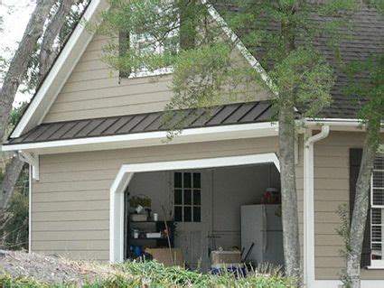 decorative metal roof over garage door, framed with brackets | Garage doors, Exterior remodel ...