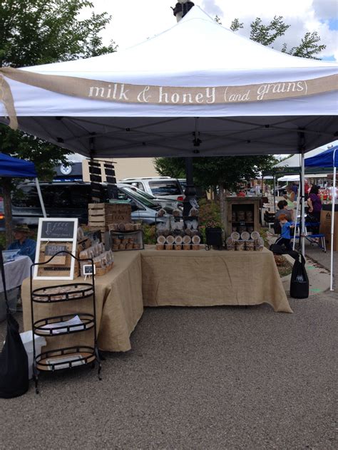 Milk & honey (and grains) farmers market stand. Burlap, weathered wood apple crates, and chalkbo ...