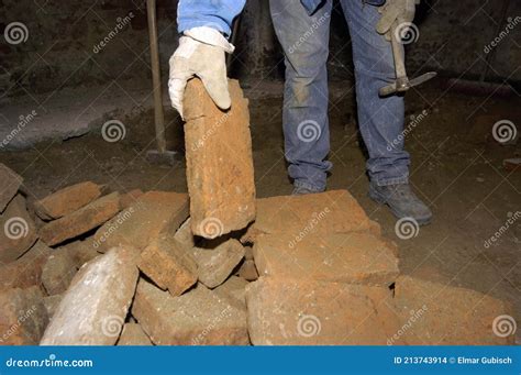 Mason builds a brick wall stock photo. Image of site - 213743914