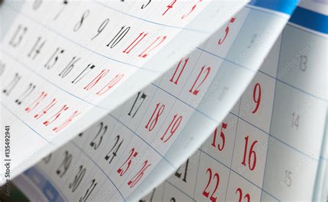 Flipping of calendar sheets with black and red numbers Stock Photo ...