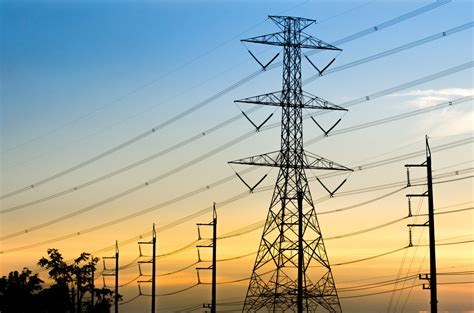 High-voltage Electrical Transmission Towers With Sunset Backgrou ...