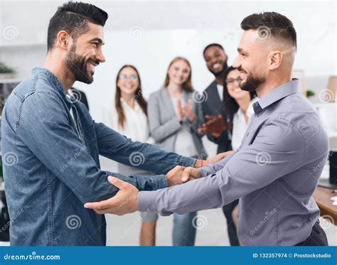 Two Men Shaking Hands at Business Meeting Stock Photo - Image of caucasian, group: 132357974