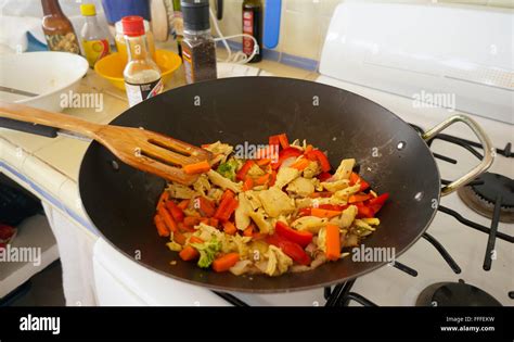 Chicken and vegetables in wok Stock Photo - Alamy