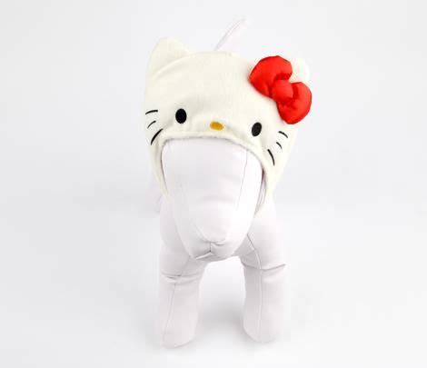 a hello kitty stuffed animal with a red bow on its head