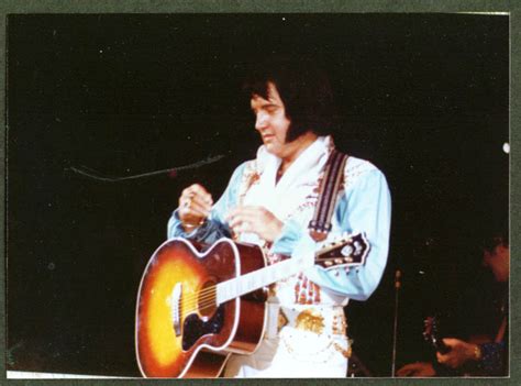 Fat Elvis Presley between songs concert candid 1970s