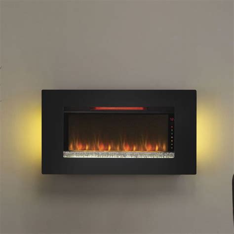 a wall mounted electric fireplace with two lights on each side and an ...