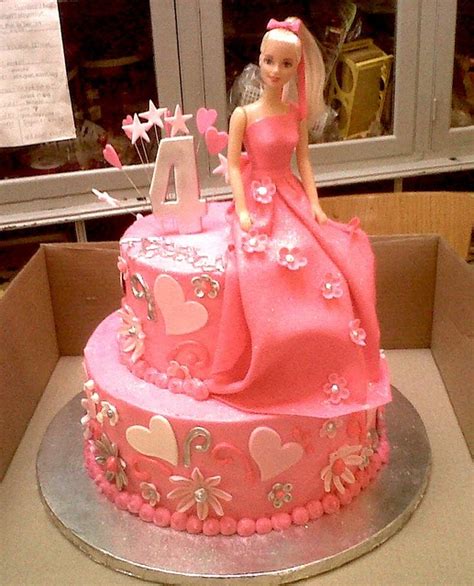 2-tier Wicked Chocolate cake iced in pink butter icing decorated with barbie in fondant dress ...