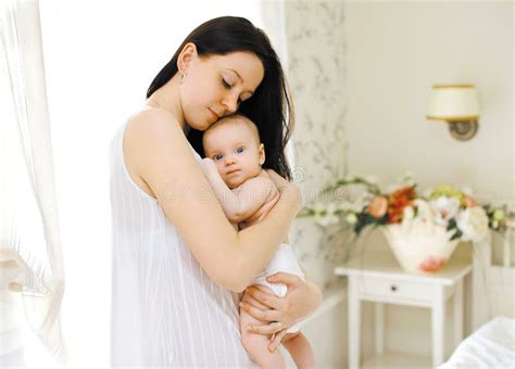 Happy Mom Gently Hugs the Baby Stock Photo - Image of embracing ...