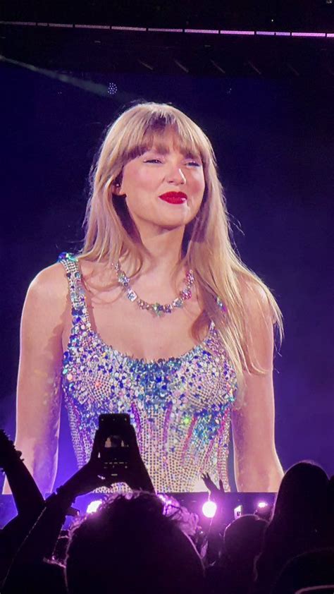 taylor swift performing on stage at an event