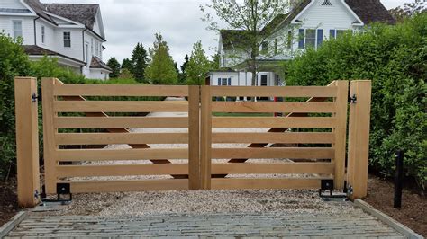 Custom design Wooden Driveway Gate with auto access controls. Made out of Western Red Cedar ...