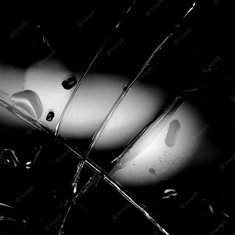 Premium Photo | Black and white image of a broken glass