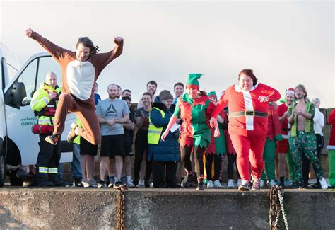 PICTURES: Nearly 60 plunge into Burghead harbour for Boxing Day Swim 2023