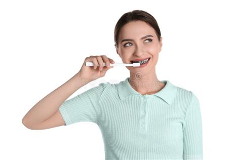 Young Woman Brushing Teeth with Charcoal Toothpaste on White Background ...