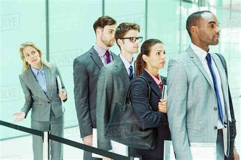 Business people waiting in line - Stock Photo - Dissolve