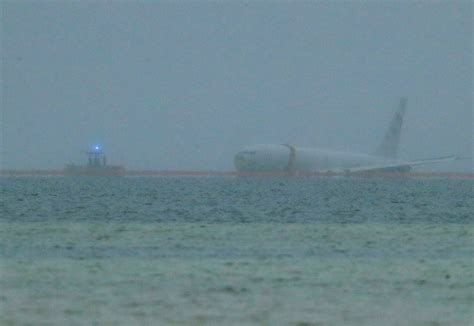 Navy plane overshoots runway, ends up in ocean; all 9 aboard escape unharmed - syracuse.com