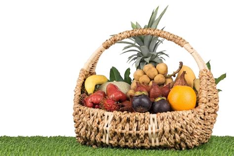 Premium Photo | Tropical fruits inside basket