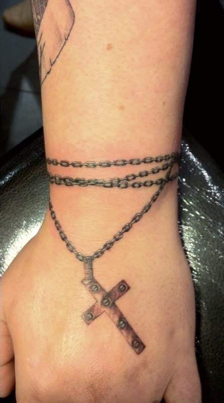 Rosary tattoos wrist | Chain tattoo, Wrist tattoos for women, Cross necklace tattoo