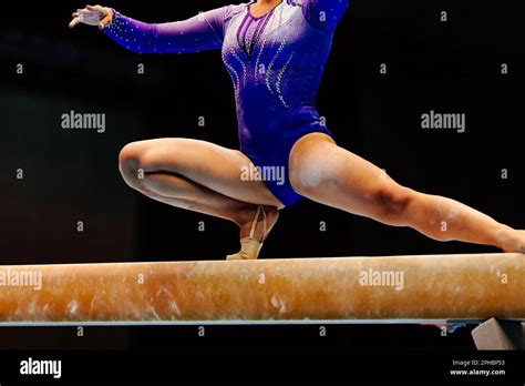 female gymnast athlete balancing on balance beam gymnastics, olympic sports included in summer ...