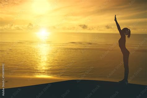 Silhouette young woman practicing yoga on the beach at sunset. Stock Illustration | Adobe Stock