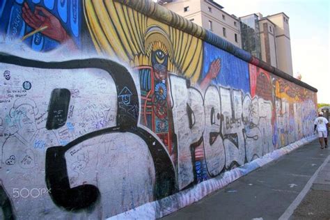 Graffiti on the Berlin wall - The East side gallery stands as a medium ...