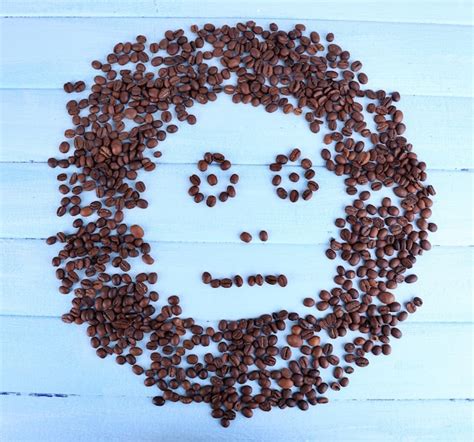 Premium Photo | Face of coffee beans on blue wooden background