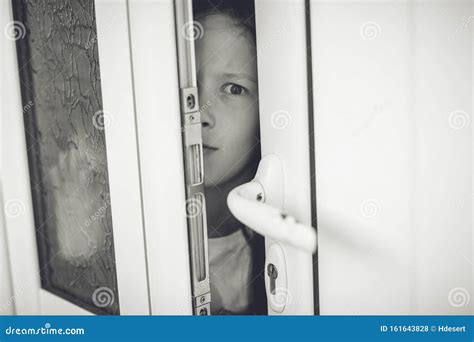 Scared Girl Kid in Opened Door. Safety Concept Stock Photo - Image of ...