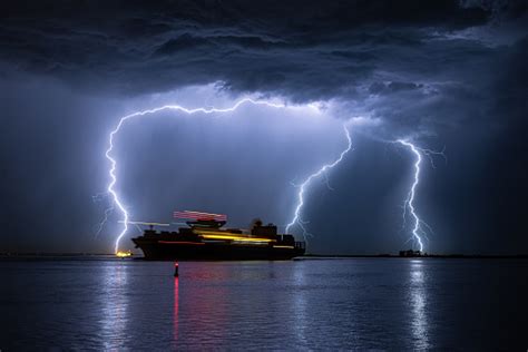 Sailing Ship During A Severe Lightning Storm Stock Photo - Download Image Now - Storm, Container ...