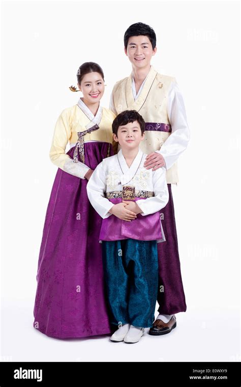 a family wearing traditional Korean outfits Stock Photo - Alamy