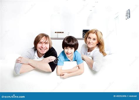 Happy Family in the Interior Stock Photo - Image of father, embracing ...