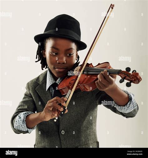 Young african boy playing violin hi-res stock photography and images ...