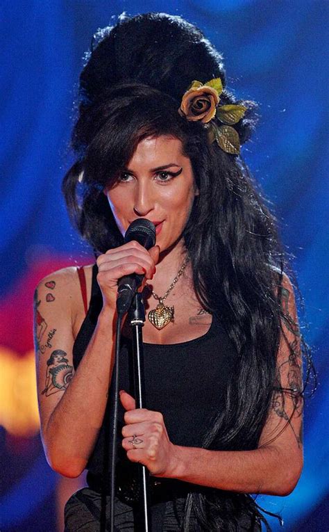 Amy Winehouse's 11 Tattoos & Their Meanings - Body Art Guru