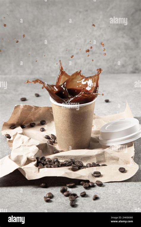 Coffee splash on light background. Vertical format Stock Photo - Alamy