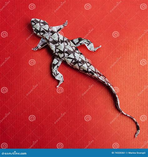 Origami lizard on red stock image. Image of characters - 74320361