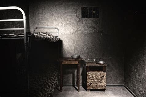 Premium Photo | A dark empty prison cell with bunk bed and bedside ...