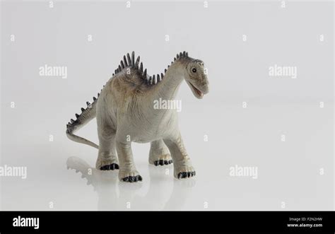 Dinosaur toy isolated on white Stock Photo - Alamy