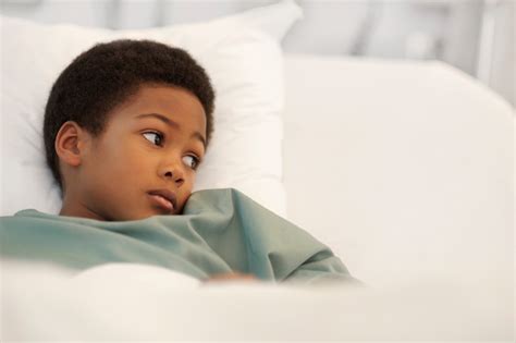 Black-child-layingin-hospital-bed - RateMDs Health News