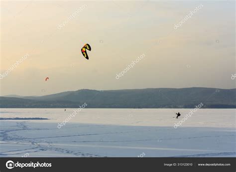 Snowkiting the athlete in equipment controls the kite and extrem ...