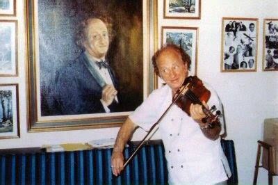 Larry Fine playing the violin.