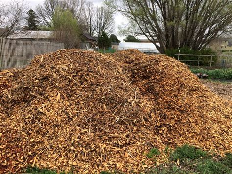 WHY WE USE WOOD CHIPS FOR MULCH - Heritage Flower Farm