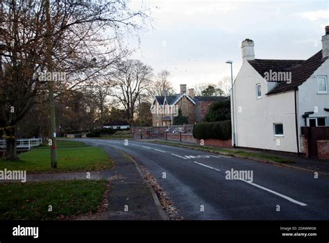 Road in Ruskington village with house under construction and white ...