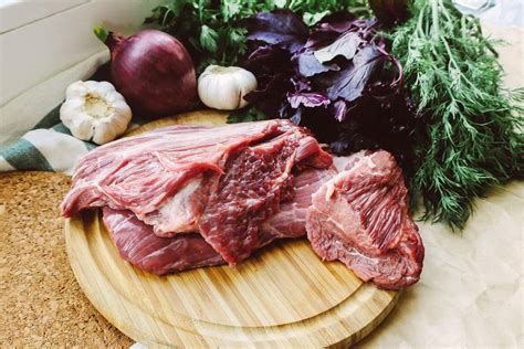 Sliced Meat on Brown Wooden Round Plate · Free Stock Photo