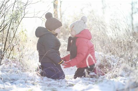 Premium Photo | Children in winter park play