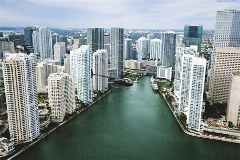 Skyscrapers and helicopter above Miami River, Brickell, Downtown Miami, Florida, USA stock photo