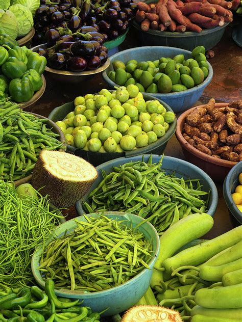 Vegetables In Market, India by Adrian Pope