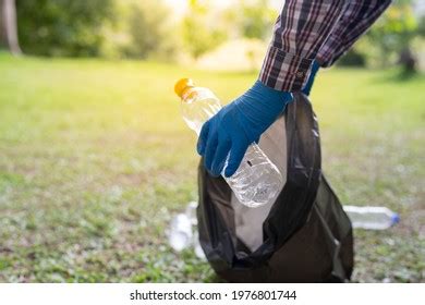 Man Hand Picking Garbage Park Stock Photo 1976801744 | Shutterstock