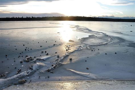 Ice Cracking On The Lake Photograph by Siyano Prach