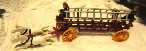 VTG CAST IRON horse drawn fire engine ladder wagon w/2 drivers toy. $55.95 - PicClick