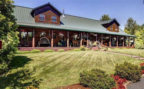 I love the look of the forest green roofing against the dark wood of this rustic cabin home. I ...