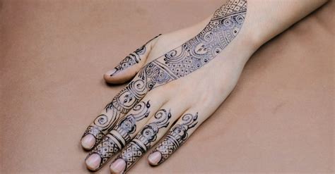 Close-Up Photo Of Hand With Tattoos · Free Stock Photo